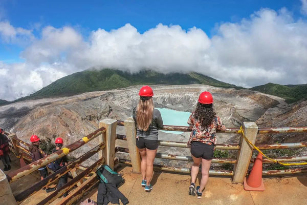 Bailey and her friend stand at the viewpoint overlooking Poas Volcano Costa Rica